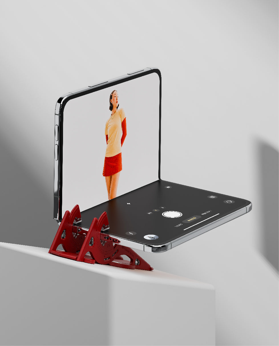 A foldable phone held along its hinge edge, its screen upright like a small laptop