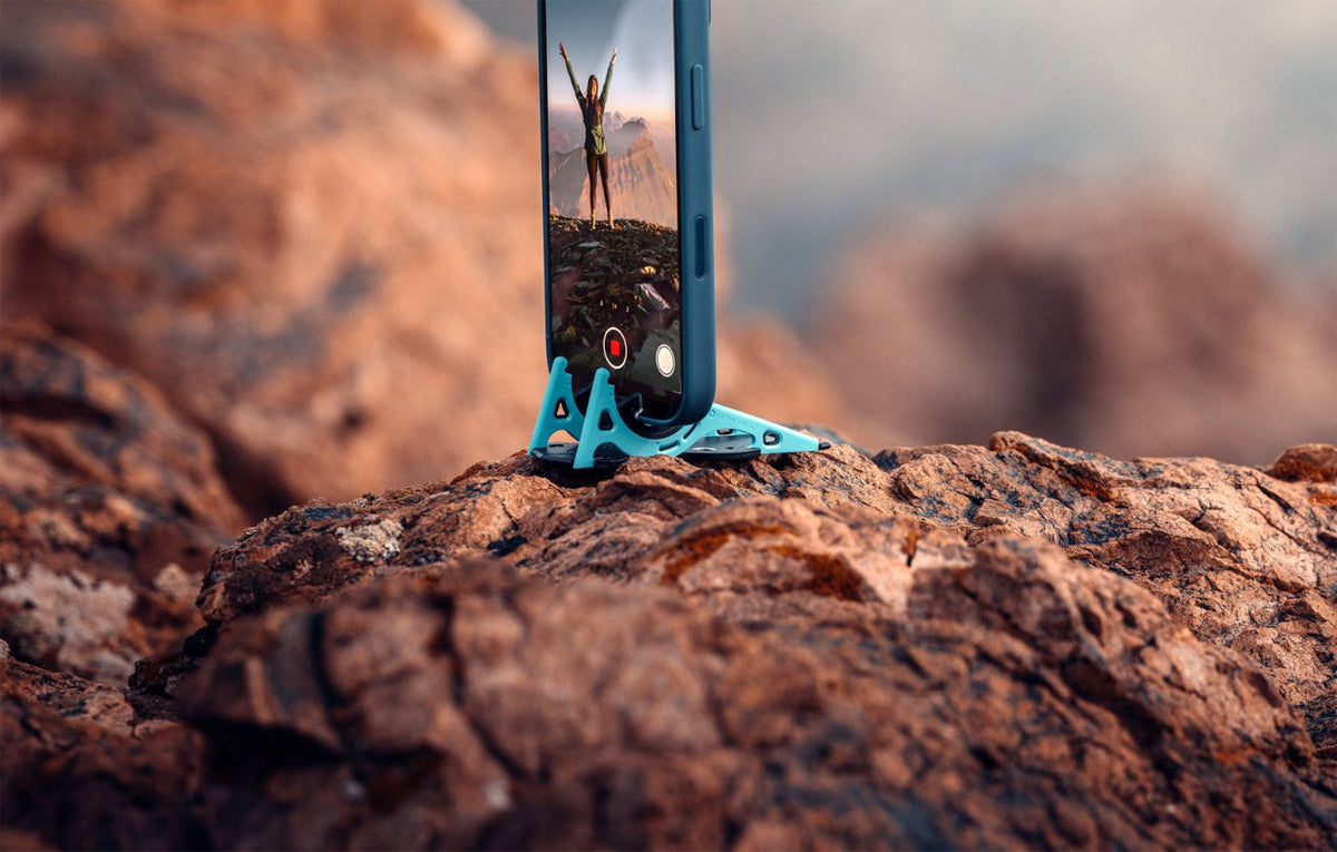 Pocket Tripod holding a phone on a red rock outcrop