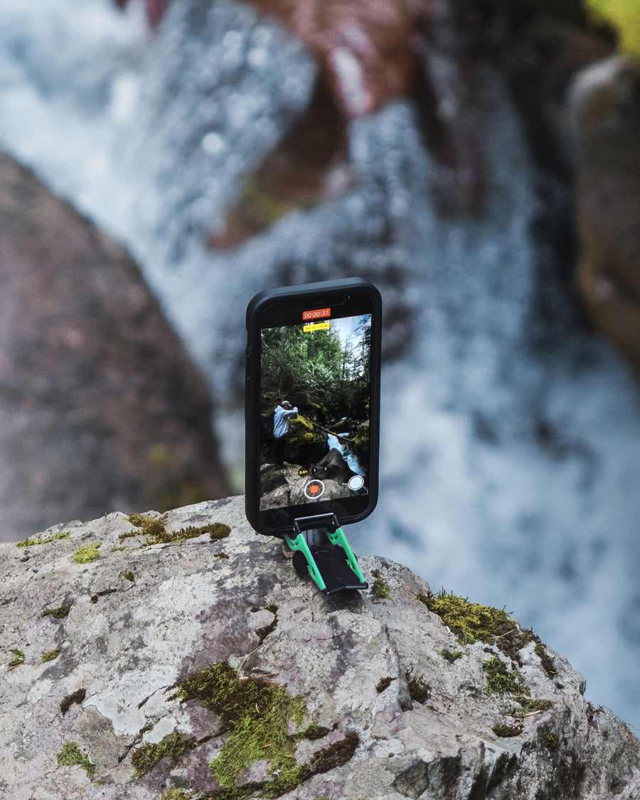 Phone facing a waterfall