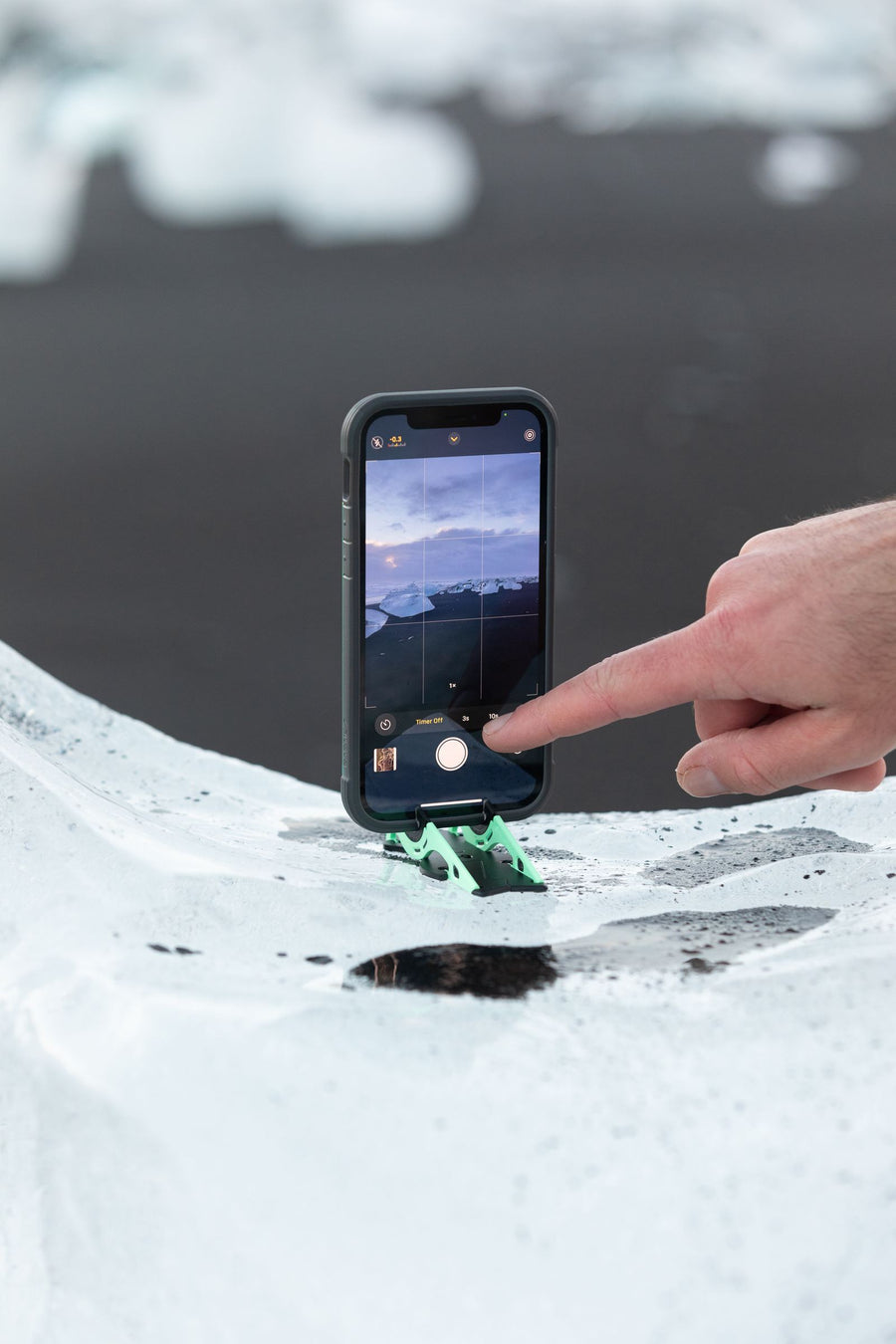 Phone resting on ice without sinking in