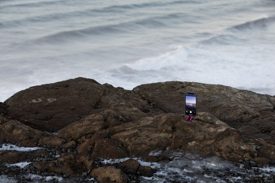 Pocket Tripod on a rock the waves reach